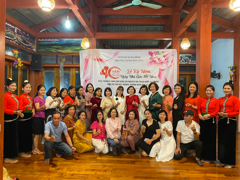 A group of people posing for a photo
Description automatically generated