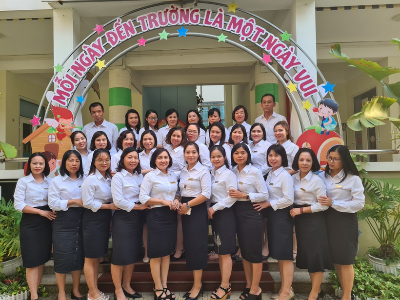 A group of people posing for a photo
Description automatically generated