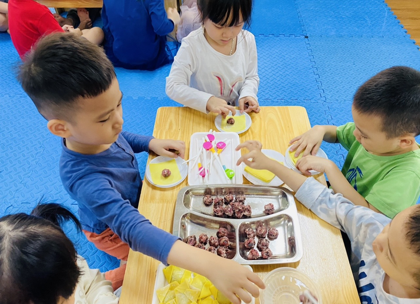 A picture containing person, child, indoor, child
Description automatically generated