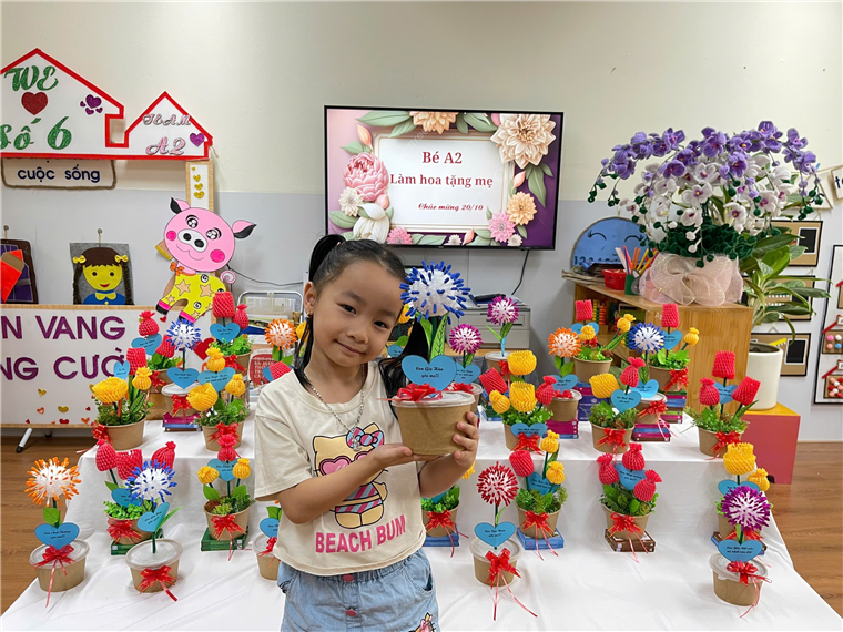 A child holding a cup of coffee

Description automatically generated