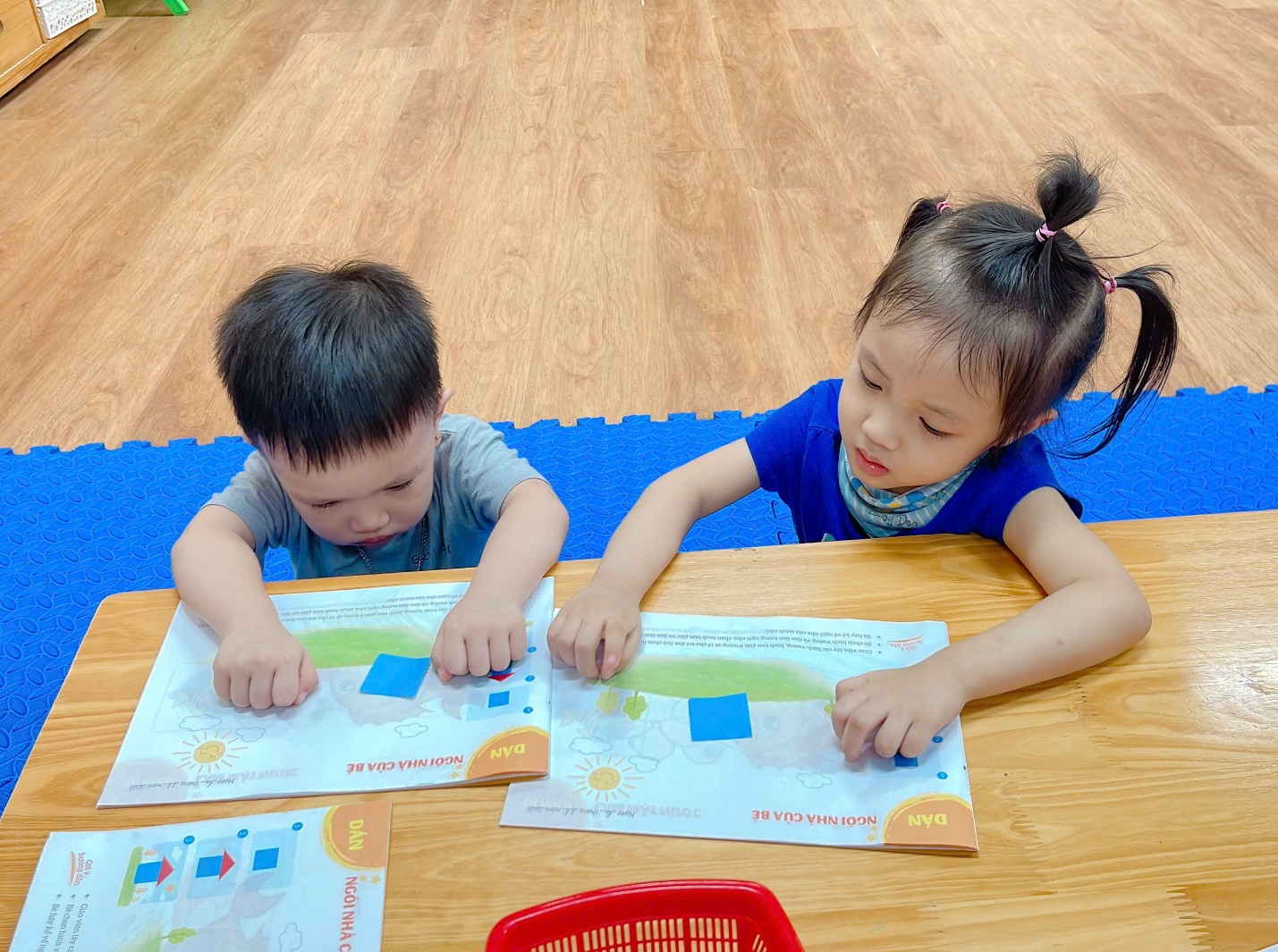 A group of children sitting at a table
Description automatically generated