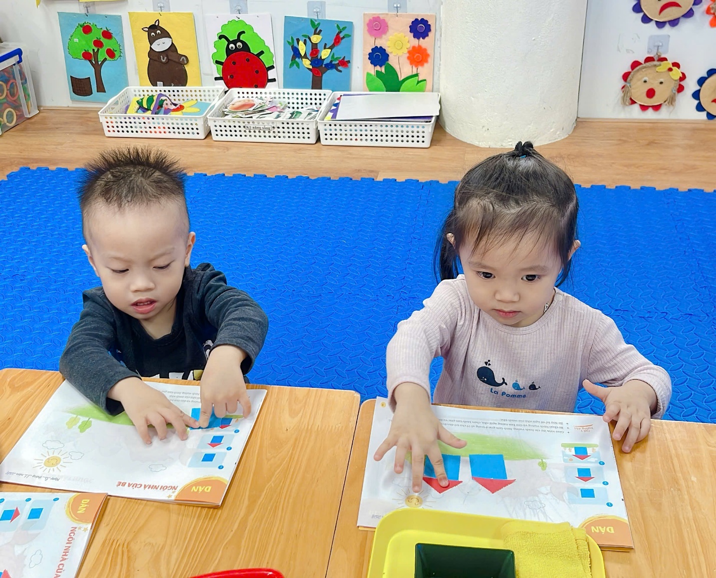 A group of children sitting at a table
Description automatically generated