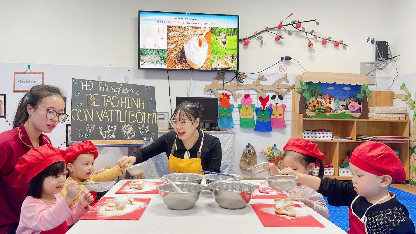 A group of people sitting at a table with bowls

Description automatically generated