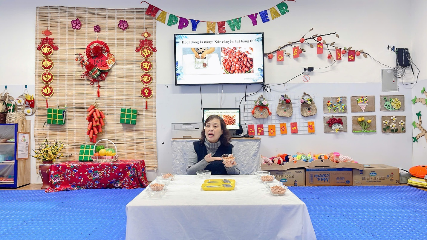 A person sitting at a table

Description automatically generated