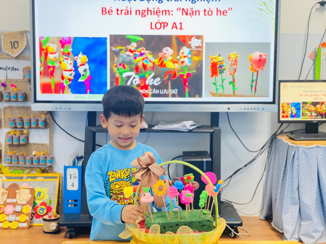 A child holding a basket of flowers
Description automatically generated