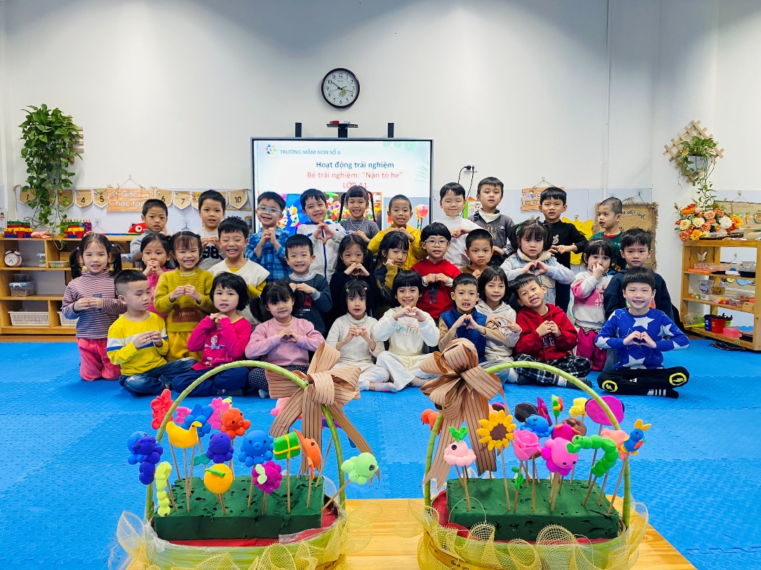 A group of children posing for a photo
Description automatically generated