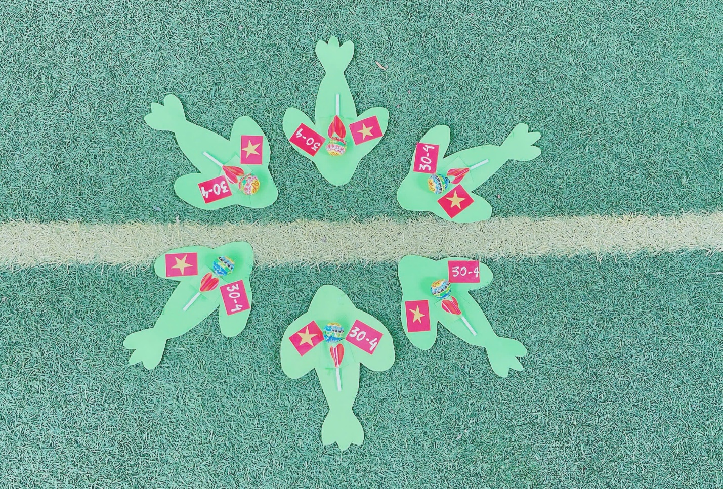 A group of paper frogs with price tags
Description automatically generated