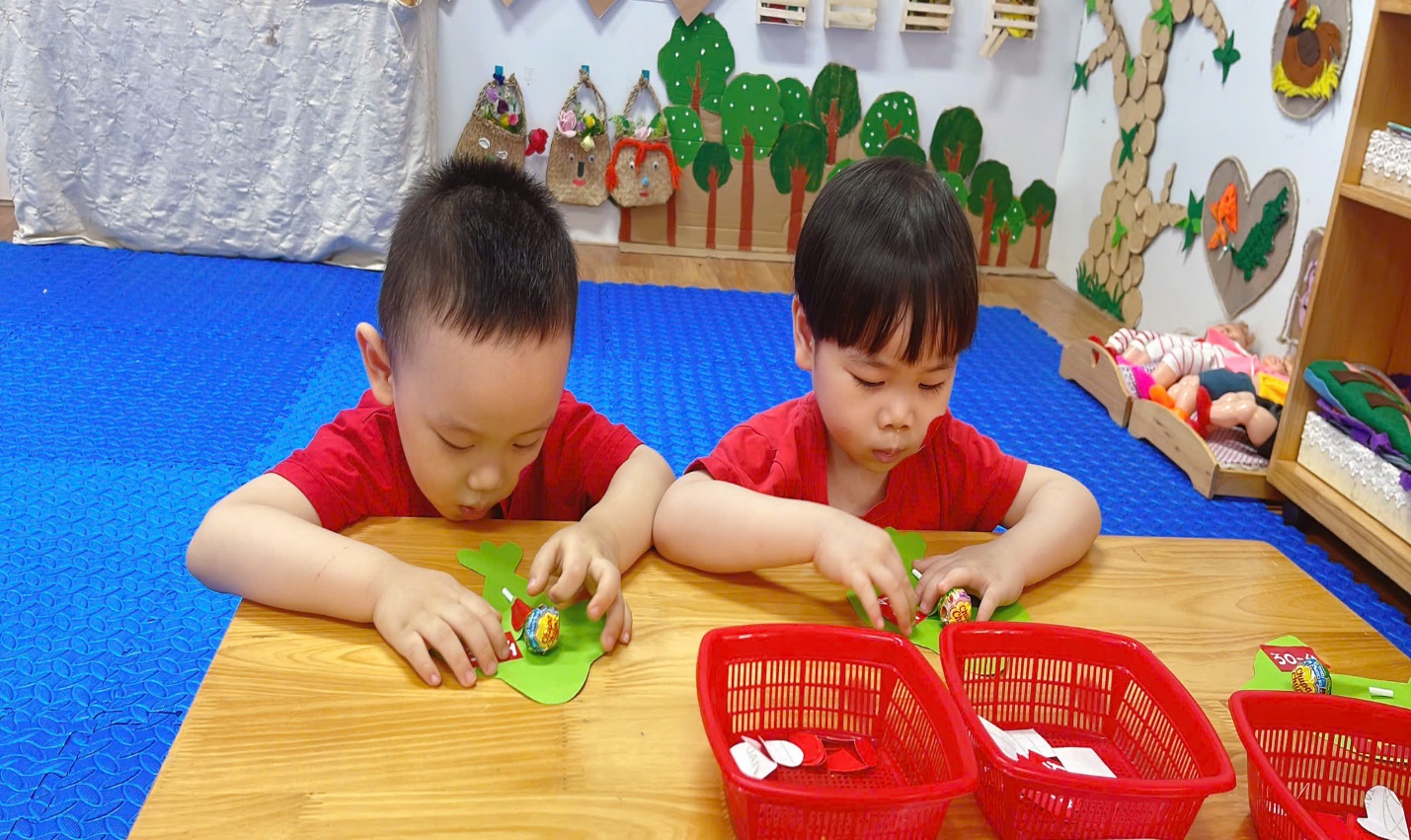 Two young boys playing with toys
Description automatically generated