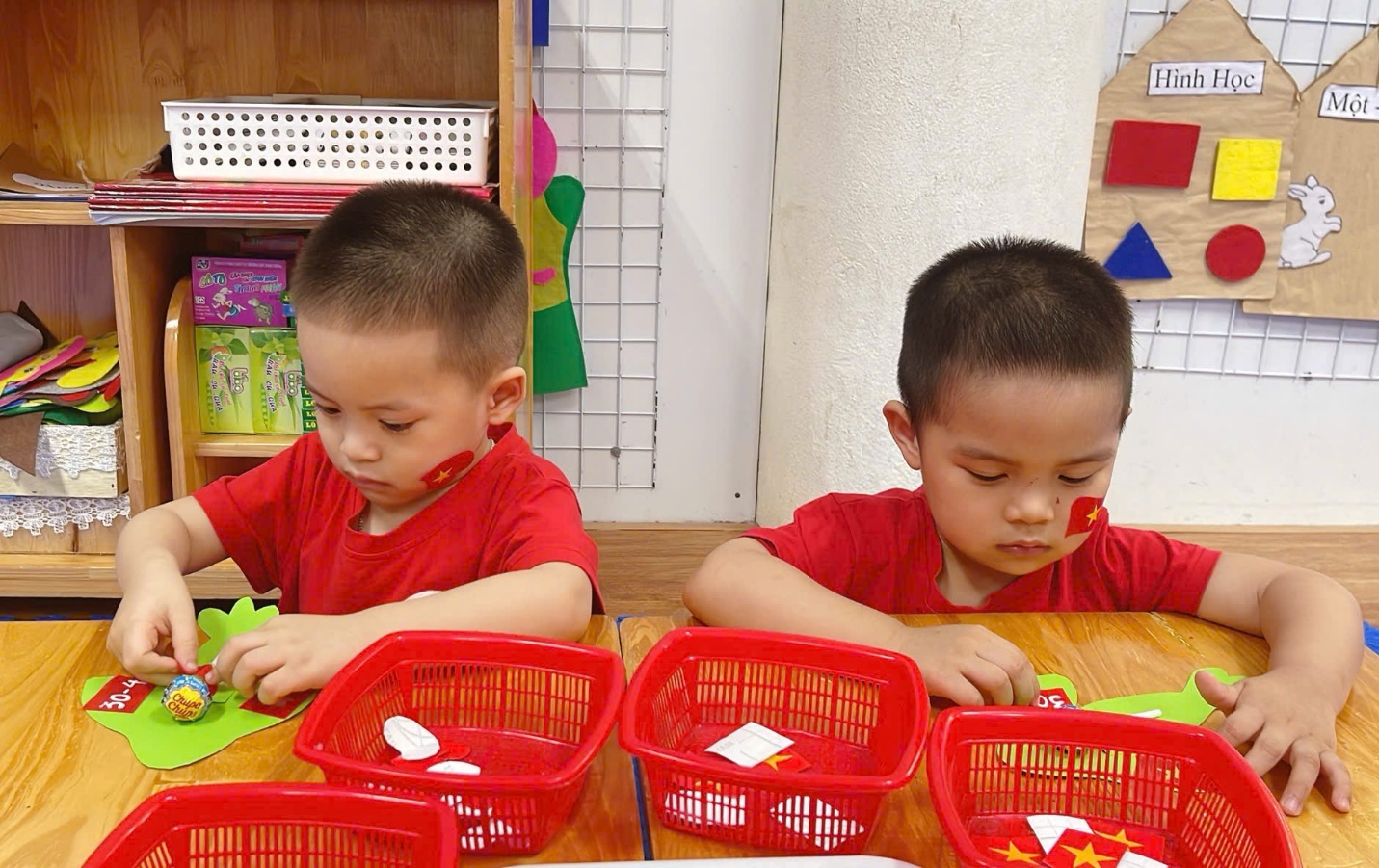 A group of young boys playing with toys
Description automatically generated