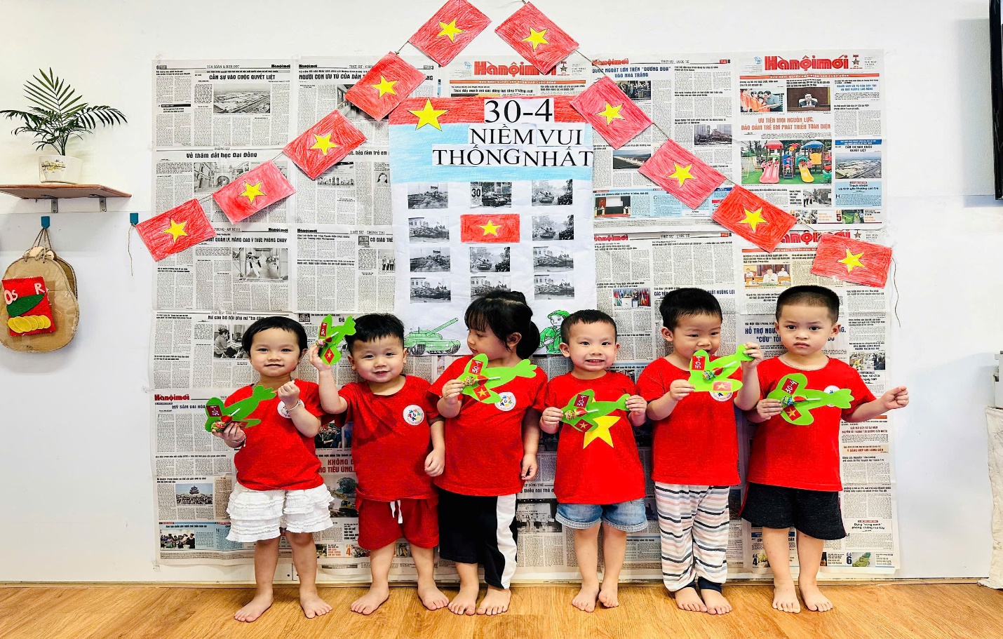 A group of children in red shirts
Description automatically generated
